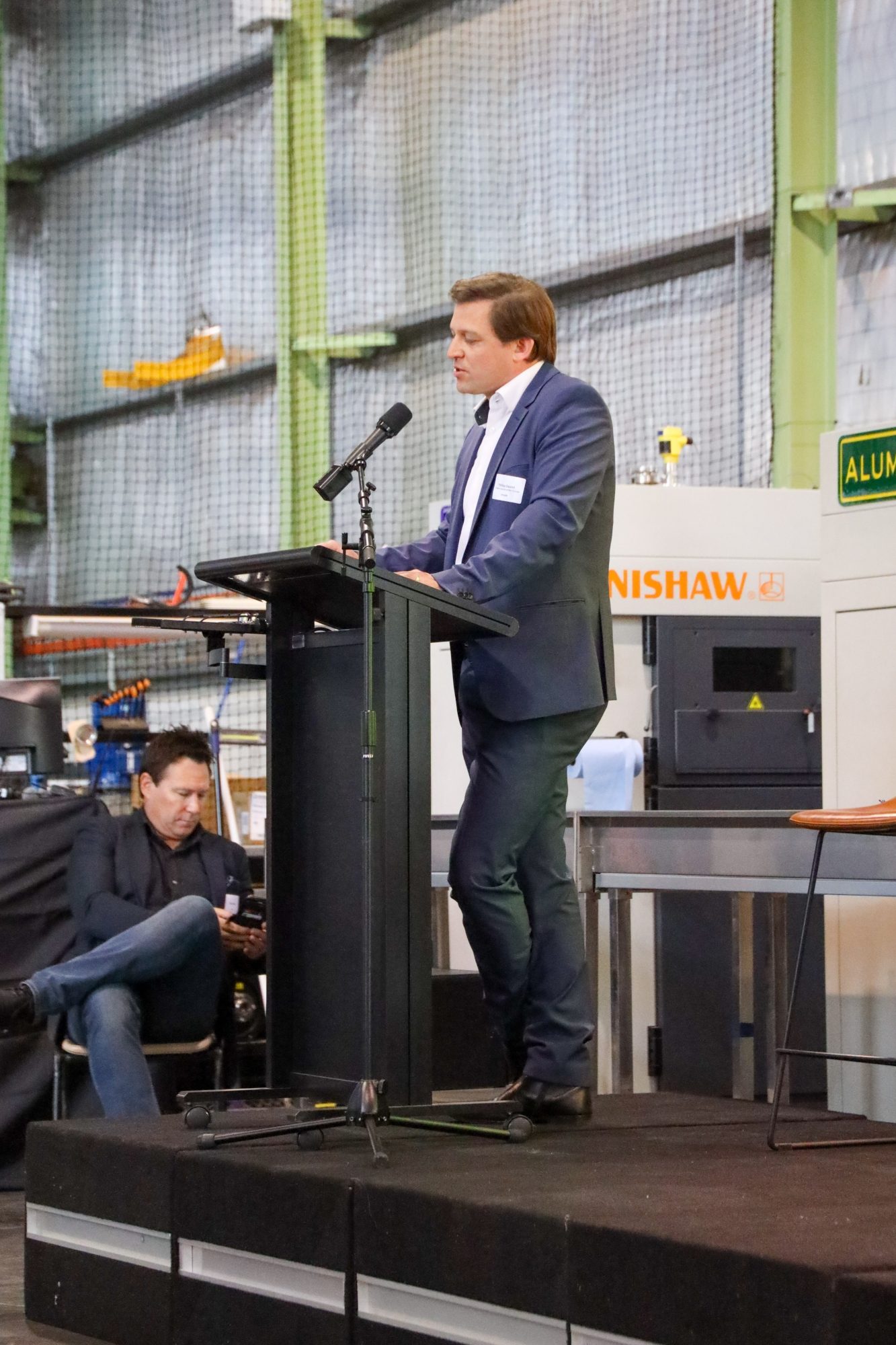 Man on stage giving speech