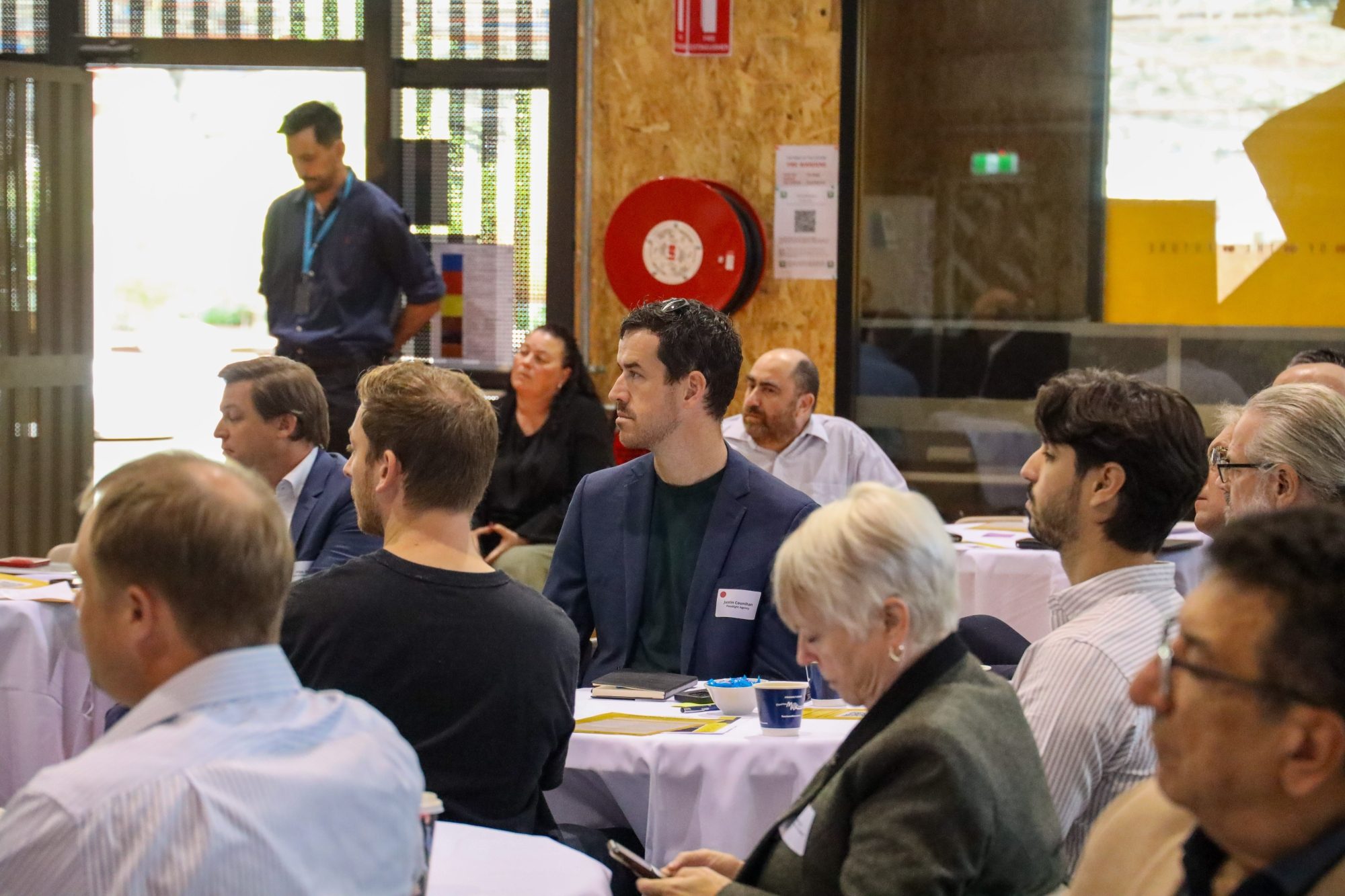 People in room looking to the left direction