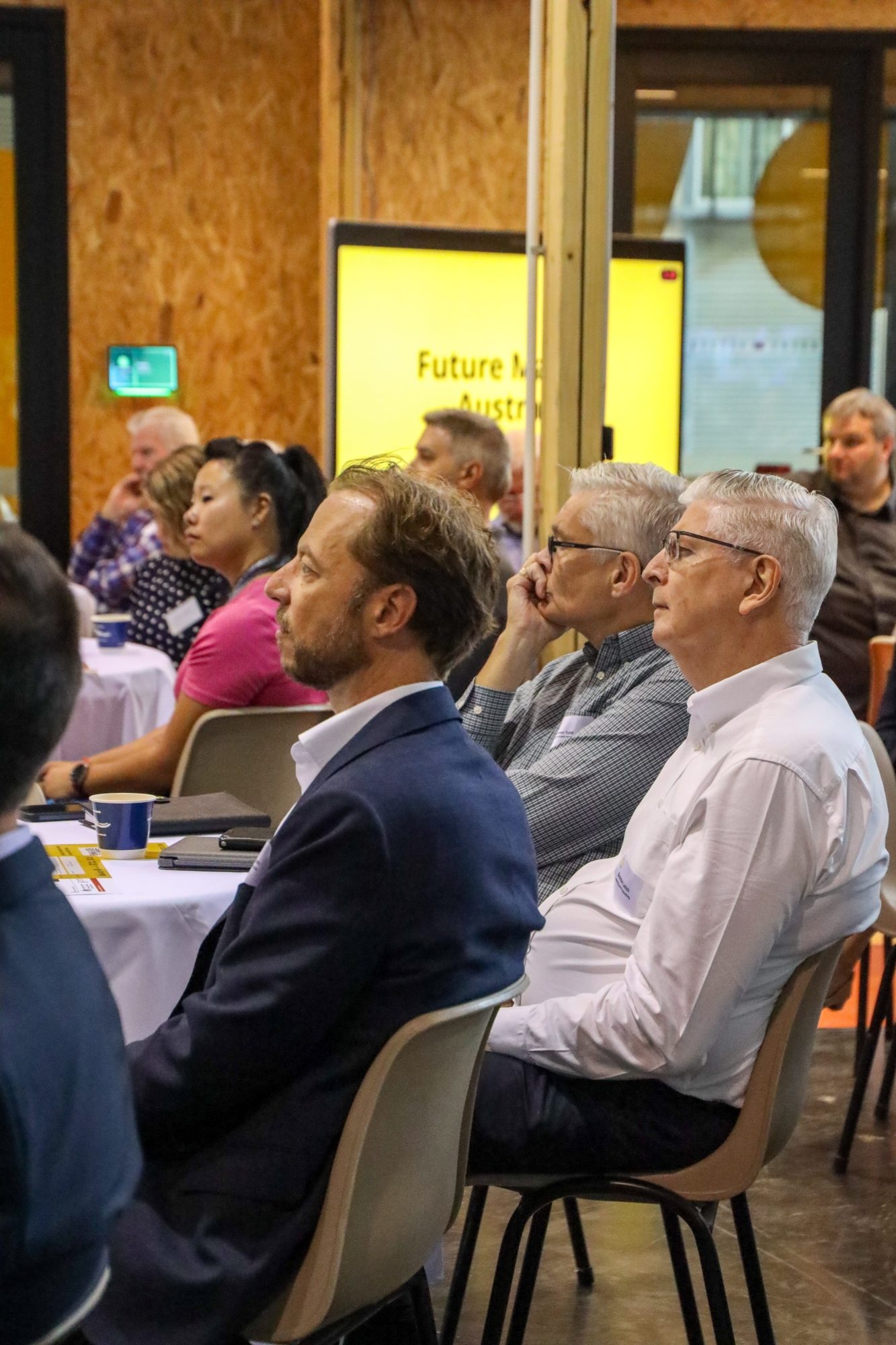 People in room looking in left direction